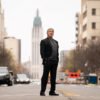 Tulsa királya 1. évad kritika thumbnail. Sylvester Stallone stands on the middle of a street in Tulsa.